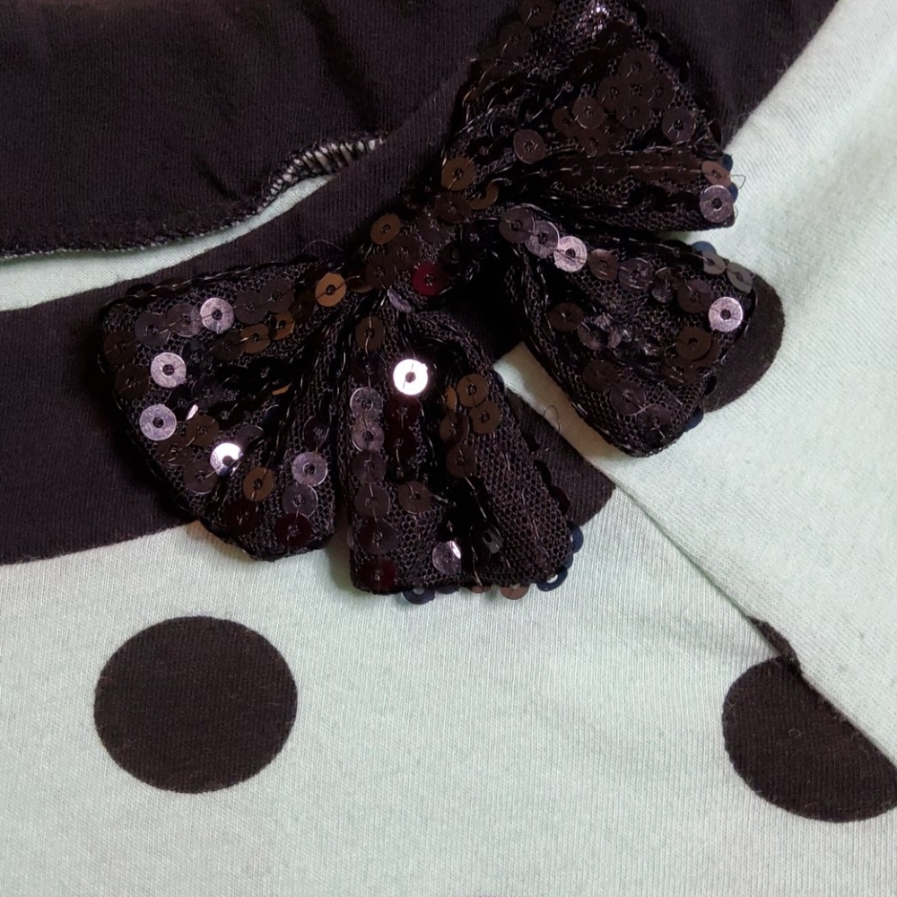 Mint green and black polka-dot top